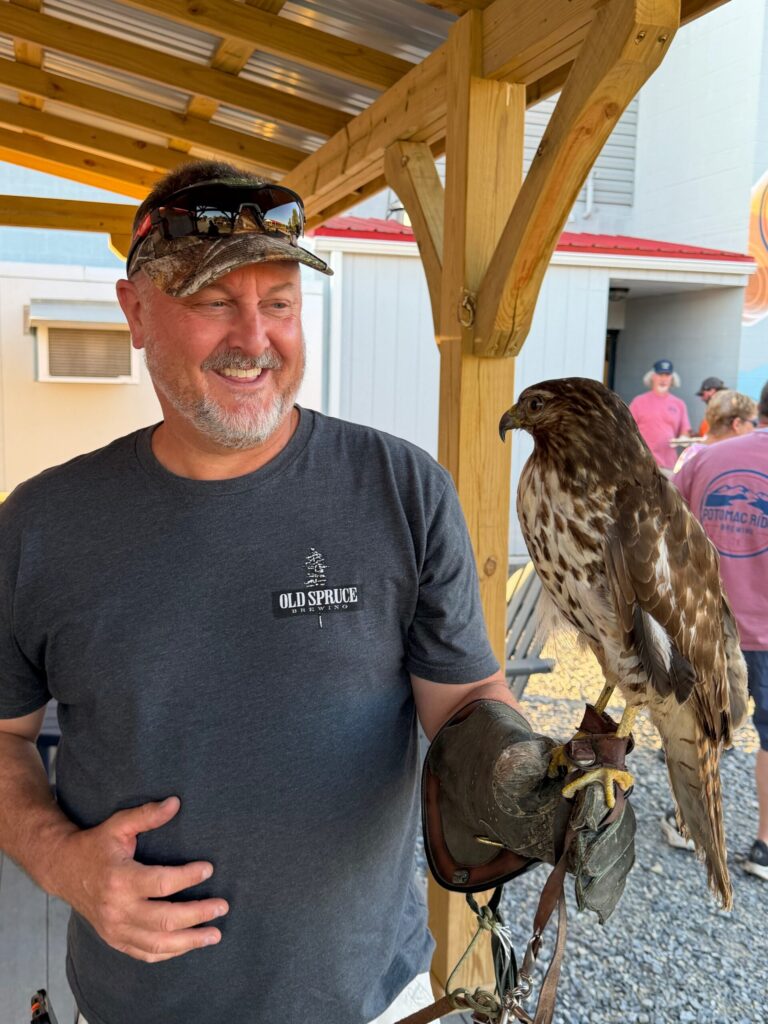Husband holding a Red Tailed Hawk. He thoroughly enjoyed this experience.