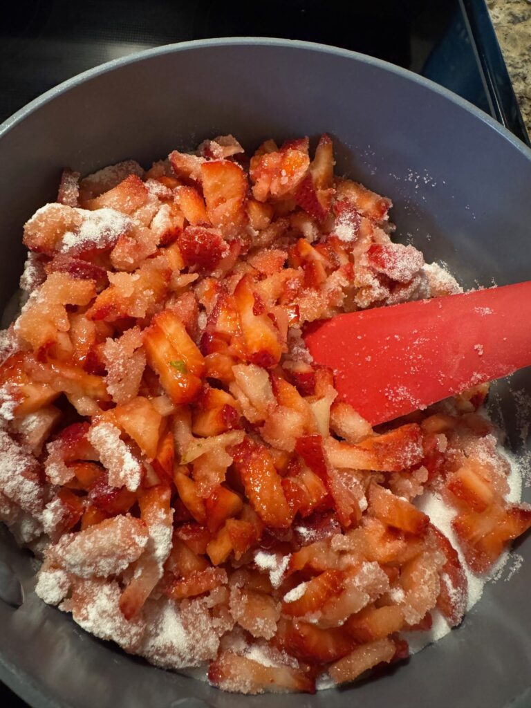 Plant City, FL sliced strawberries cooking with sugar